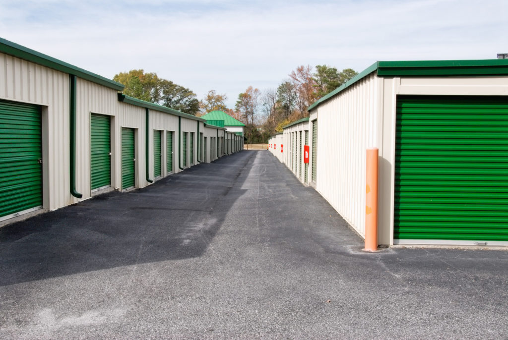 multiple mini storage units with bright green doors